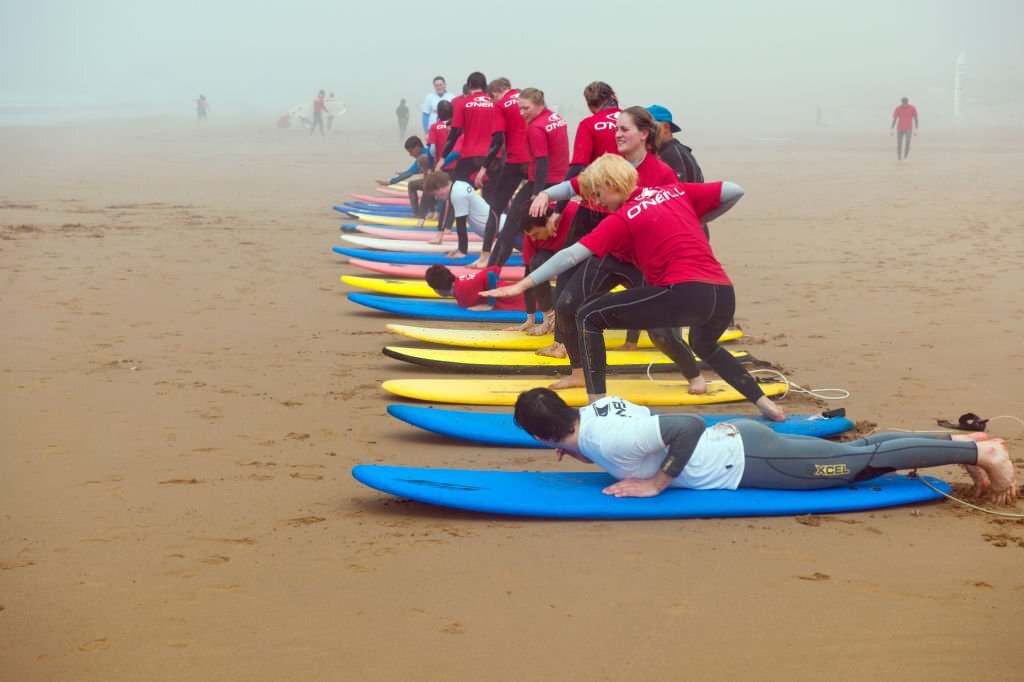 Morocco -Young tourists practising on their surfs